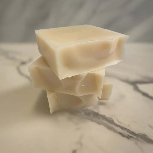 stack of three soaps on a marble surface
