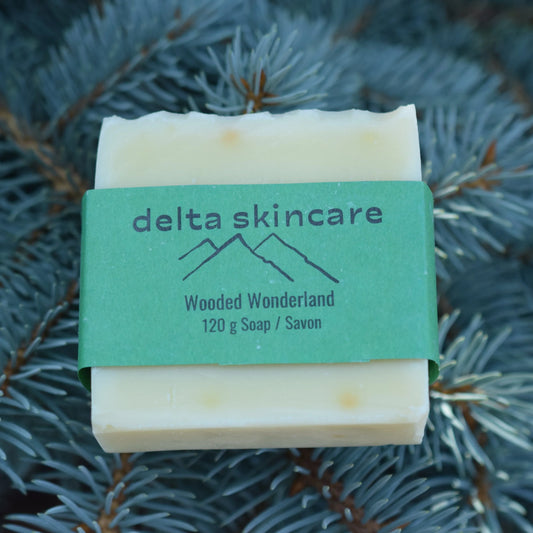 Delta Skincare Wooded Wonderland natural soap bar on pine branches