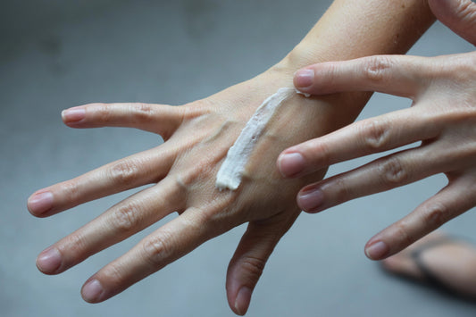 Applying moisturizing hand cream on skin for hydration and skincare